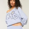 Bluza z nadrukiem NYC z odkrytymi ramionami Bluza z nadrukiem NYC z odkrytymi ramionami