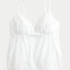 Błyszcząca haftowana bluzka babydoll