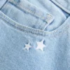 Dżinsy bootcut z niskim stanem i haftem w kształcie gwiazdy Dżinsy bootcut z niskim stanem i haftem w kształcie gwiazdy