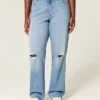 Dżinsy typu dad jeans z wysokim stanem, z przetarciami i średnim wypraniem Dżinsy typu dad jeans z wysokim stanem, z przetarciami i średnim wypraniem