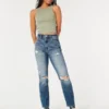 Dżinsy typu mom jeans z bardzo wysokim stanem, przetarciami i średnim wybarwieniem Dżinsy typu mom jeans z bardzo wysokim stanem, przetarciami i średnim wybarwieniem