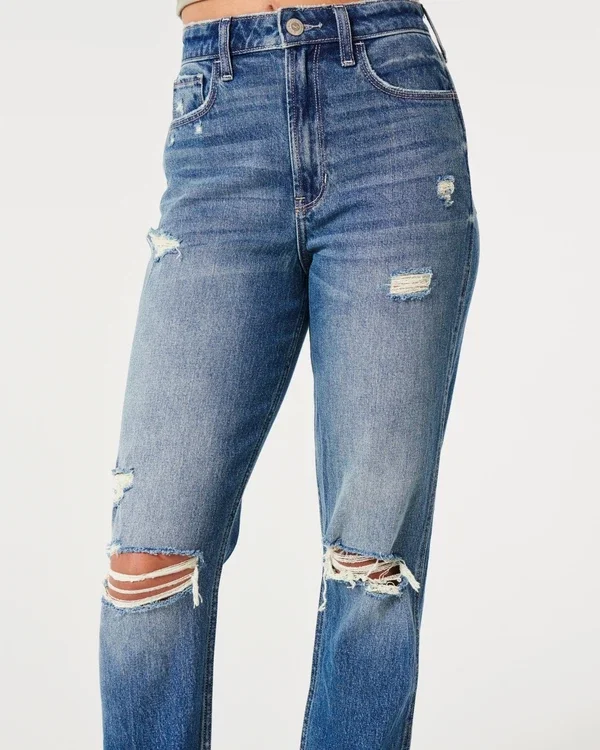 Dżinsy typu mom jeans z bardzo wysokim stanem, przetarciami i średnim wybarwieniem Dżinsy typu mom jeans z bardzo wysokim stanem, przetarciami i średnim wybarwieniem