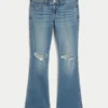 Dżinsy z niskim stanem, przetarciami i średnim wypraniem, o kroju bootcut Dżinsy z niskim stanem, przetarciami i średnim wypraniem, o kroju bootcut