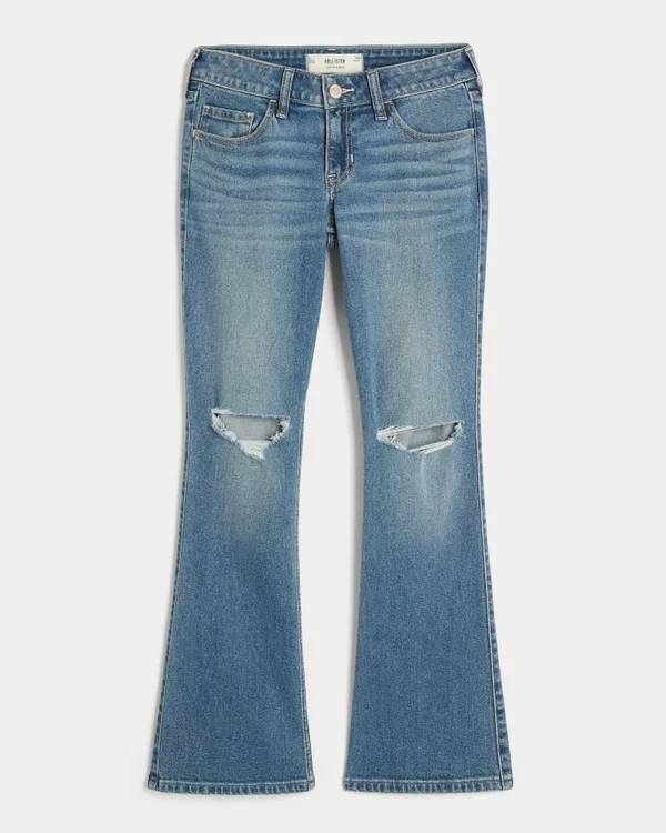 Dżinsy z niskim stanem, przetarciami i średnim wypraniem, o kroju bootcut Dżinsy z niskim stanem, przetarciami i średnim wypraniem, o kroju bootcut