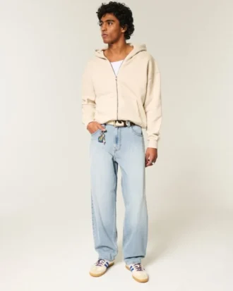 Haftowane jasne jeansy typu skater baggy
