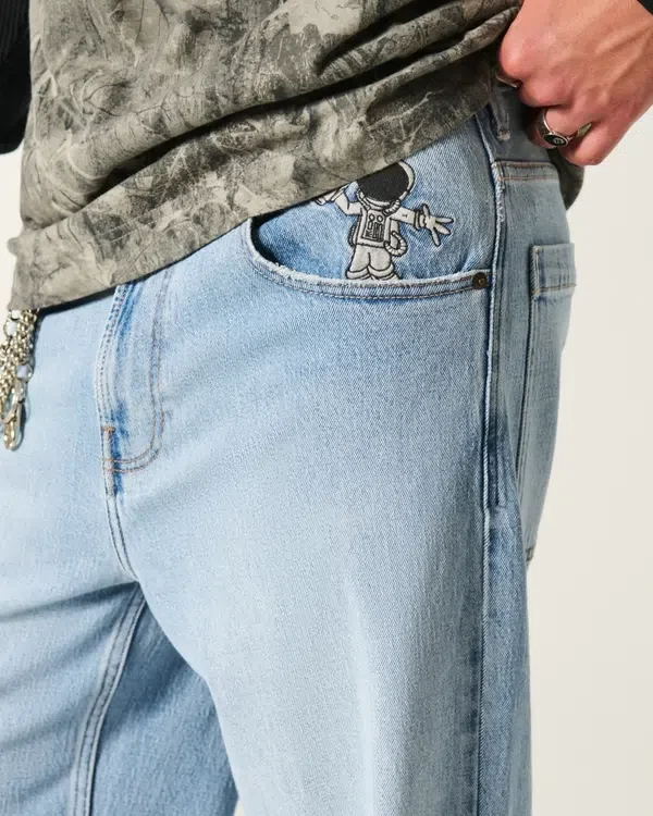 Jasne dżinsy z nadrukiem astronauty Super Baggy Jeans Jasne dżinsy z nadrukiem astronauty Super Baggy Jeans