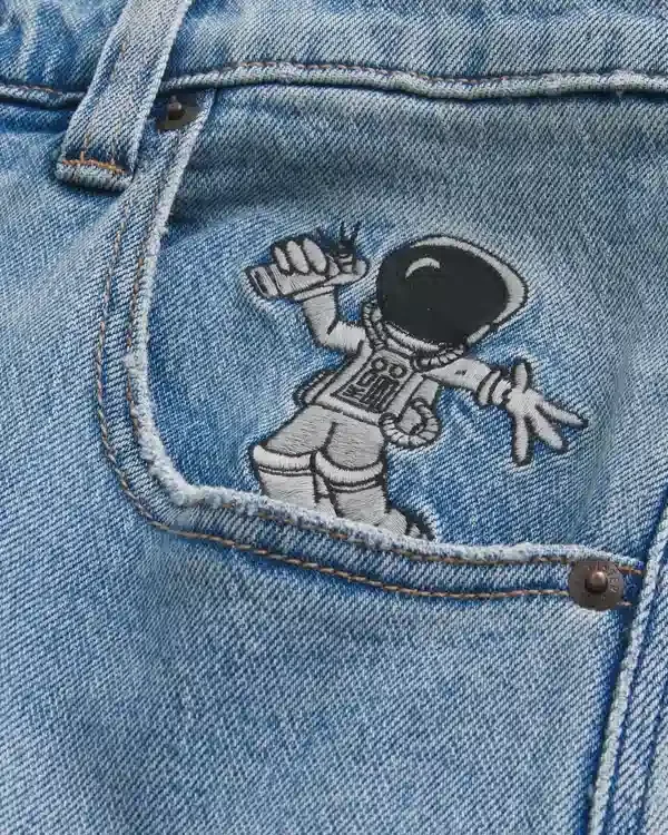Jasne dżinsy z nadrukiem astronauty Super Baggy Jeans Jasne dżinsy z nadrukiem astronauty Super Baggy Jeans