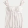 Lekka satynowa bluzka babydoll z wiązaniem Lekka satynowa bluzka babydoll z wiązaniem