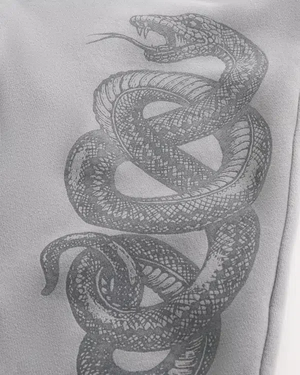 Luźne spodnie dresowe z nadrukiem Double Snake Luźne spodnie dresowe z nadrukiem Double Snake