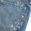 Mini szorty jeansowe z haftowanym kwiatowym wzorem, ultra niskim stanem i średnim odcieniem Mini szorty jeansowe z haftowanym kwiatowym wzorem, ultra niskim stanem i średnim odcieniem