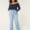 Obcisłe jeansy typu dad jeans z bardzo wysokim stanem i średnim odcieniem Obcisłe jeansy typu dad jeans z bardzo wysokim stanem i średnim odcieniem
