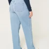 Obcisłe jeansy typu dad jeans z bardzo wysokim stanem i średnim odcieniem Obcisłe jeansy typu dad jeans z bardzo wysokim stanem i średnim odcieniem
