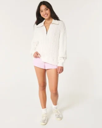 Oversize’owy sweter z półsuwakiem i splotem warkoczowym