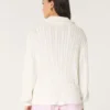 Oversize’owy sweter z półsuwakiem i splotem warkoczowym Oversize’owy sweter z półsuwakiem i splotem warkoczowym