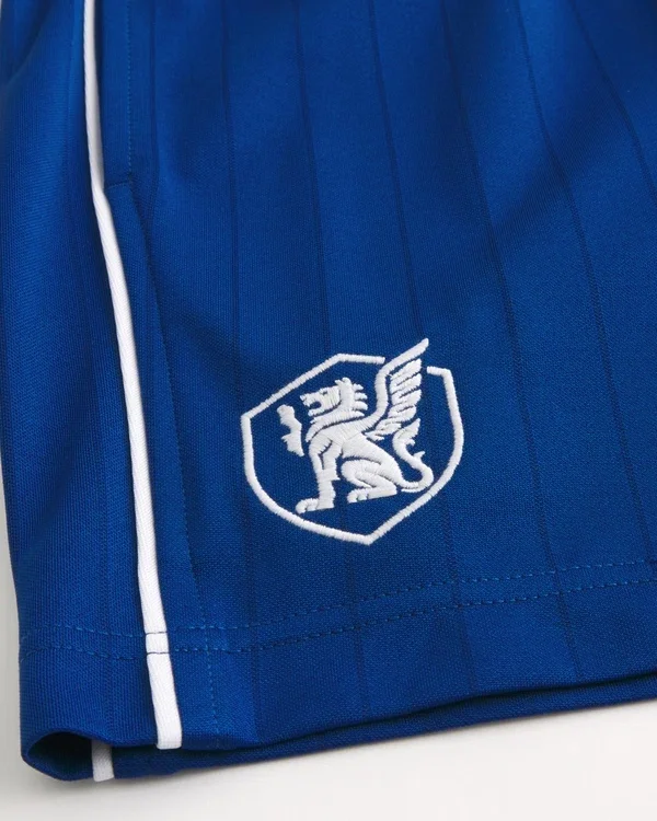 Spodenki piłkarskie z logo z dzianiny do połowy uda Spodenki piłkarskie z logo z dzianiny do połowy uda