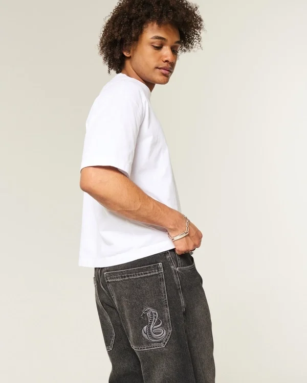 Sprane czarne jeansy skater baggy z haftowanym wężem Sprane czarne jeansy skater baggy z haftowanym wężem