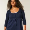 Sweter typu babydoll z dzianiny warkoczowej