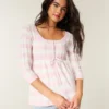 Sweter typu babydoll z dzianiny warkoczowej