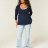 Sweter typu babydoll z dzianiny warkoczowej