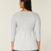 Sweter typu babydoll z dzianiny warkoczowej