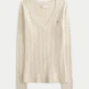 Sweter z dzianiny warkoczowej z dekoltem w serek Sweter z dzianiny warkoczowej z dekoltem w serek