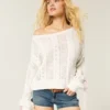 Sweter z rękawami z kokardkami i splotem warkoczowym