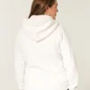Świąteczna kolekcja Sherpa-Lined Zip-Up Logo Graphic Hoodie Świąteczna kolekcja Sherpa-Lined Zip-Up Logo Graphic Hoodie