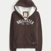 Świąteczna kolekcja Sherpa-Lined Zip-Up Logo Graphic Hoodie Świąteczna kolekcja Sherpa-Lined Zip-Up Logo Graphic Hoodie