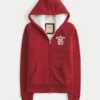 Świąteczna kolekcja Sherpa-Lined Zip-Up Logo Graphic Hoodie Świąteczna kolekcja Sherpa-Lined Zip-Up Logo Graphic Hoodie