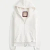 Świąteczna kolekcja Sherpa-Lined Zip-Up Logo Graphic Hoodie Świąteczna kolekcja Sherpa-Lined Zip-Up Logo Graphic Hoodie